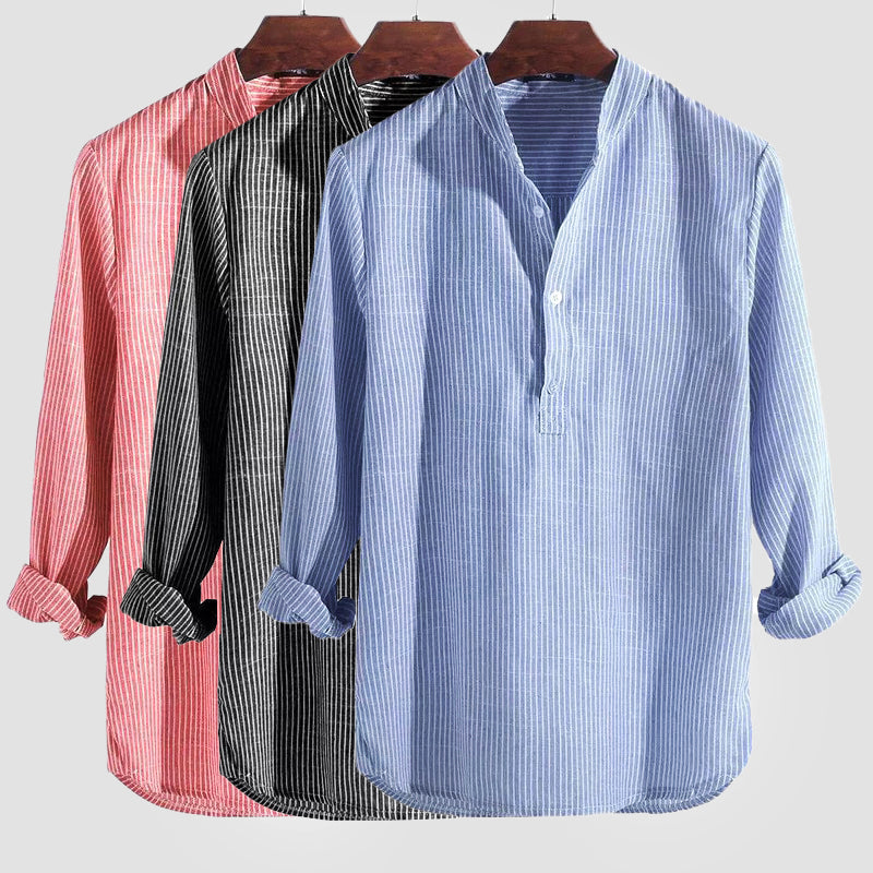 Man wearing a stylish striped long sleeve Henley shirt. Relaxed fit offers comfort for a smart casual look.