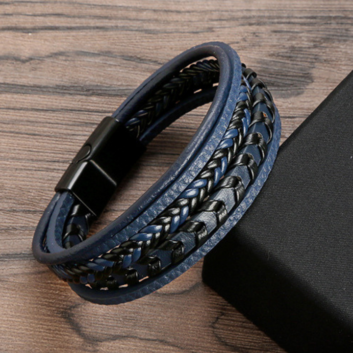 Durable men's leather bracelet, intricately braided with a secure magnetic closure. Ideal Nordic accessory.