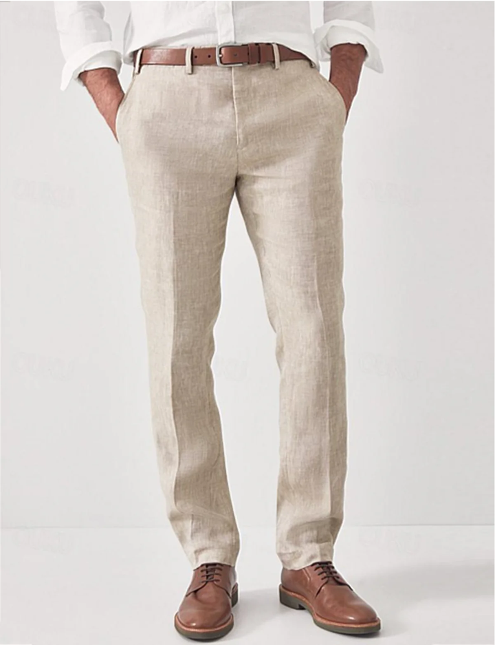 Model wearing modern fit linen trousers for men, styled for a relaxed summer look.