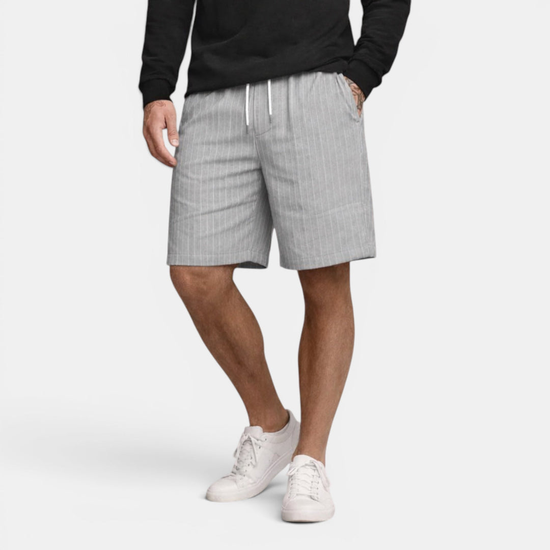 Enjoy summer in these breathable men's regular fit shorts, perfect for casual wear.