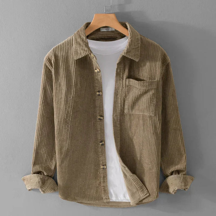 Close-up of the textured fabric on a men's timeless corduroy shirt.