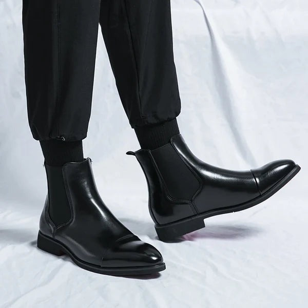 Close-up of men's leather boots showing detailed stitching and quality craftsmanship.