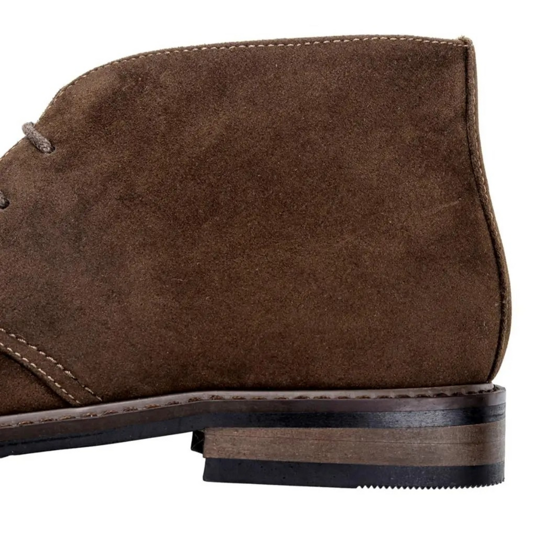 Man wearing comfortable men's chukka boots for daily activities.