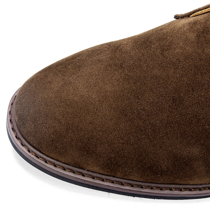 Showcasing the detailed craftsmanship of these men's durable chukka boots.
