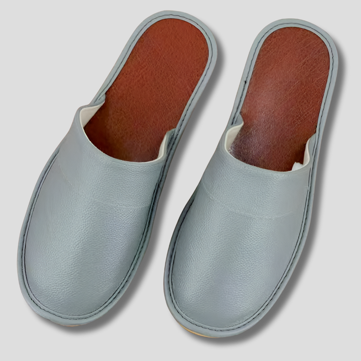 Close-up of durable sole on men's comfortable leather house slippers.