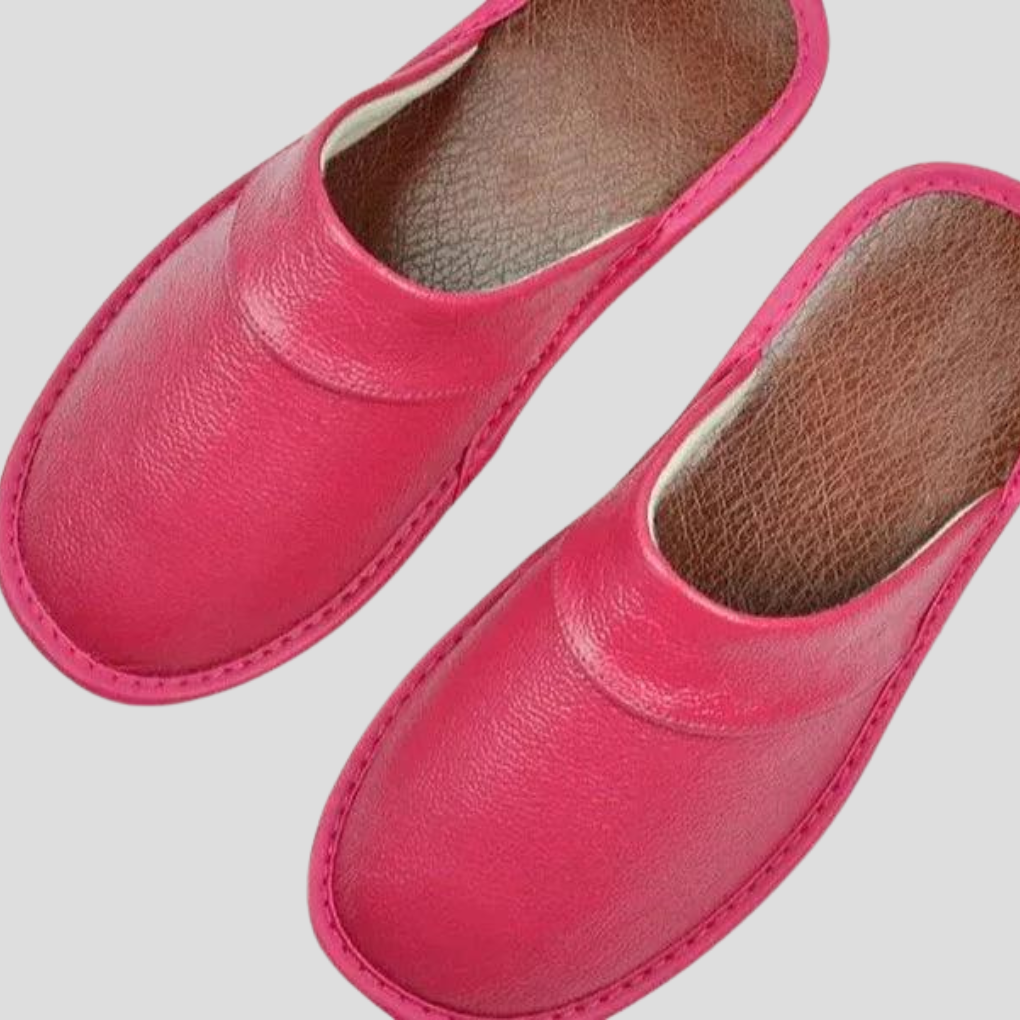Side view of men's soft leather slippers, easy slip-on home shoes.