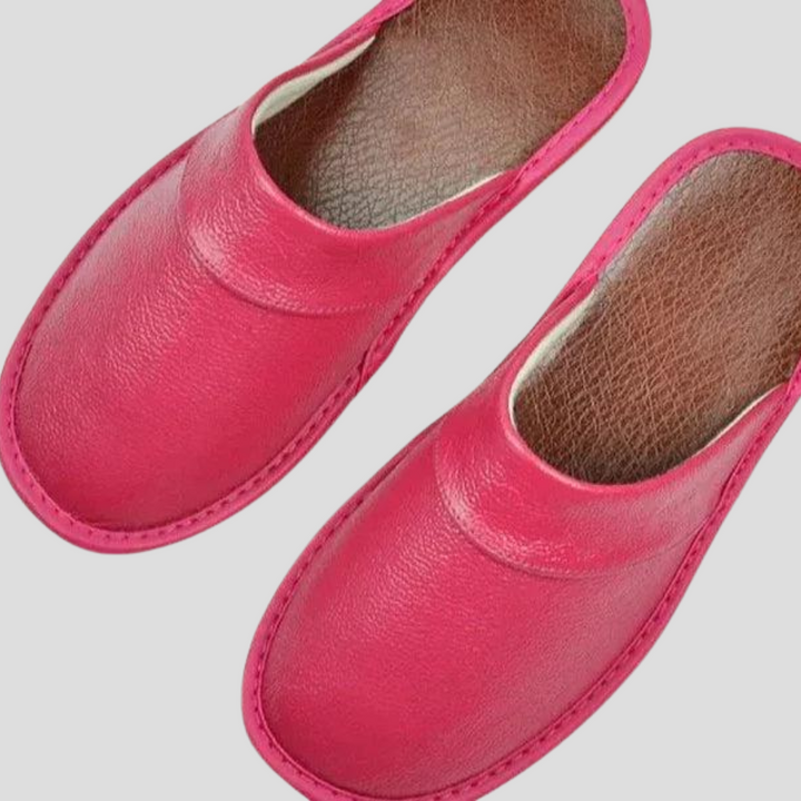 Side view of men's soft leather slippers, easy slip-on home shoes.