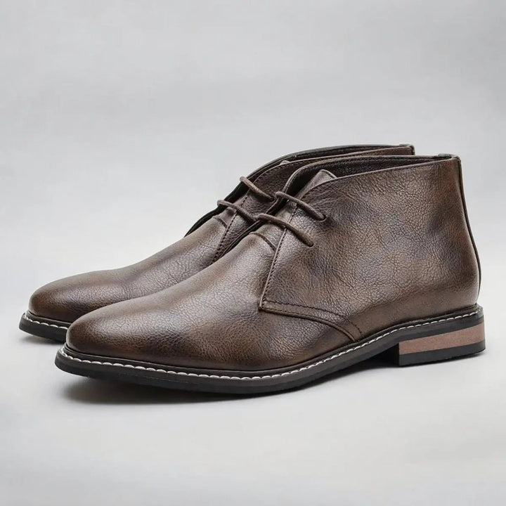 Dark brown men's chukka ankle boots with laces. Smart-casual style, versatile footwear for everyday men's fashion.