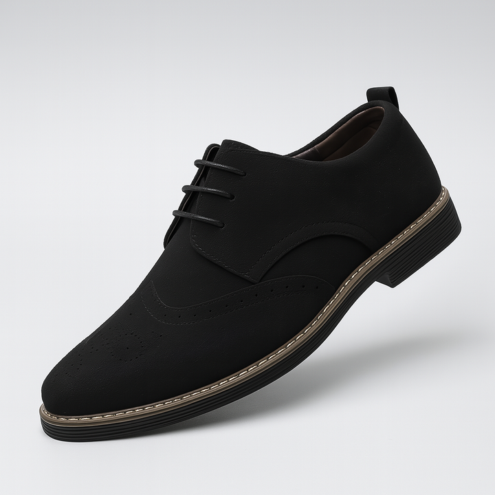 Stylish men's suede dress shoes with classic brogue detailing on Oxford silhouette.