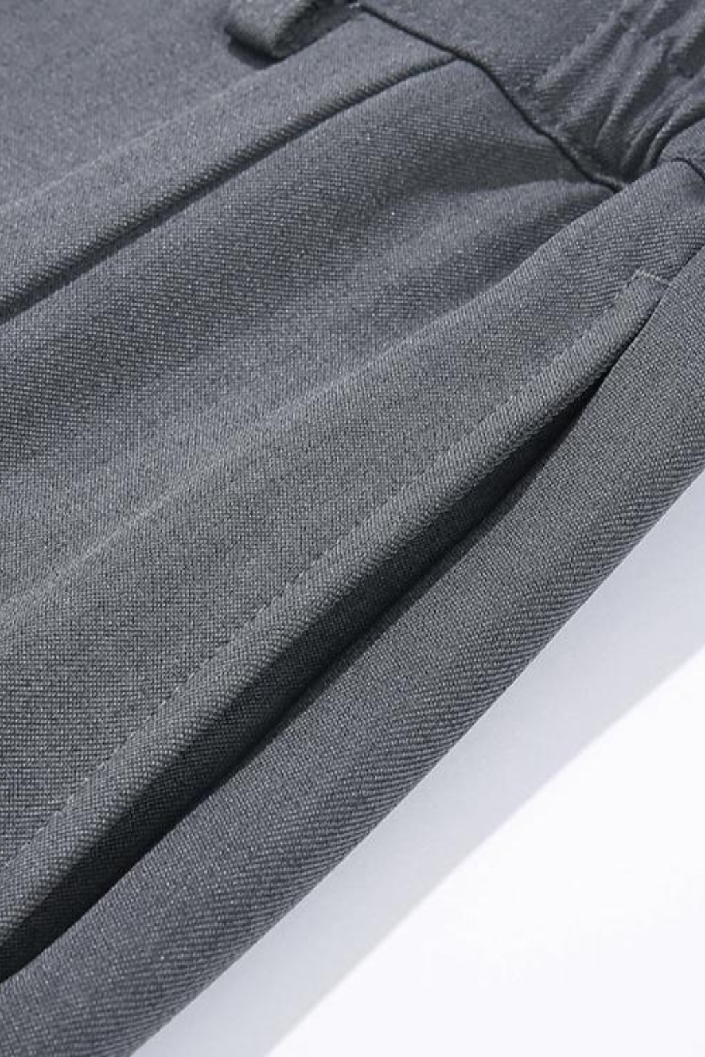 Khaki wide leg pants featuring sharp pleats for a sophisticated look
