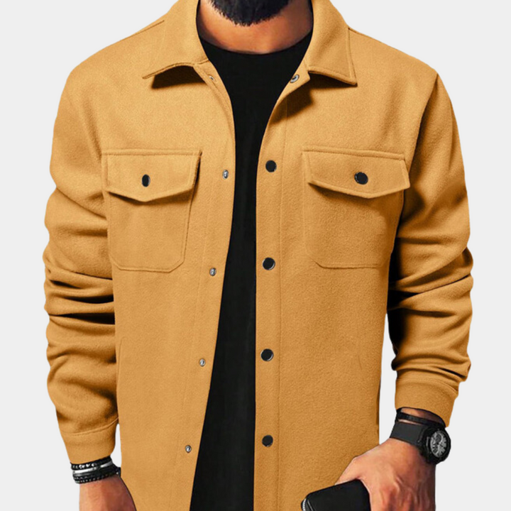 Close-up of a men's button-down jacket, highlighting texture and buttons, perfect for men's autumn fashion.