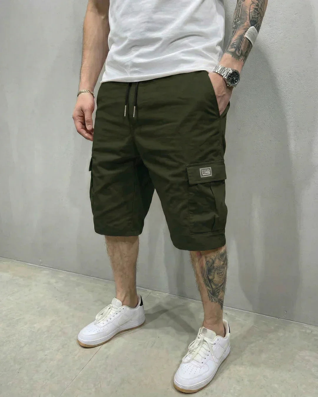 Casual men's cargo shorts with adjustable drawstring waist and practical flap pockets for everyday wear.