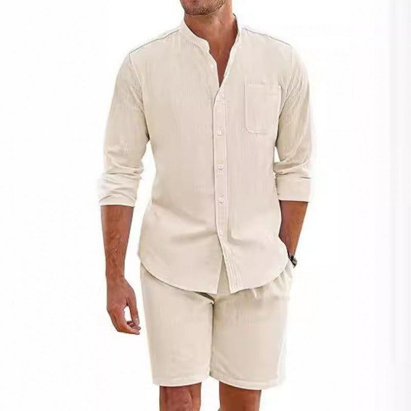 Stylish man modeling a casual summer shirt & shorts set, perfect for relaxed beach or warm weather wear.