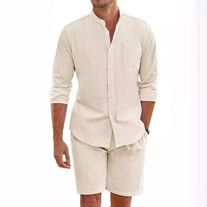 Stylish man modeling a casual summer shirt & shorts set, perfect for relaxed beach or warm weather wear.