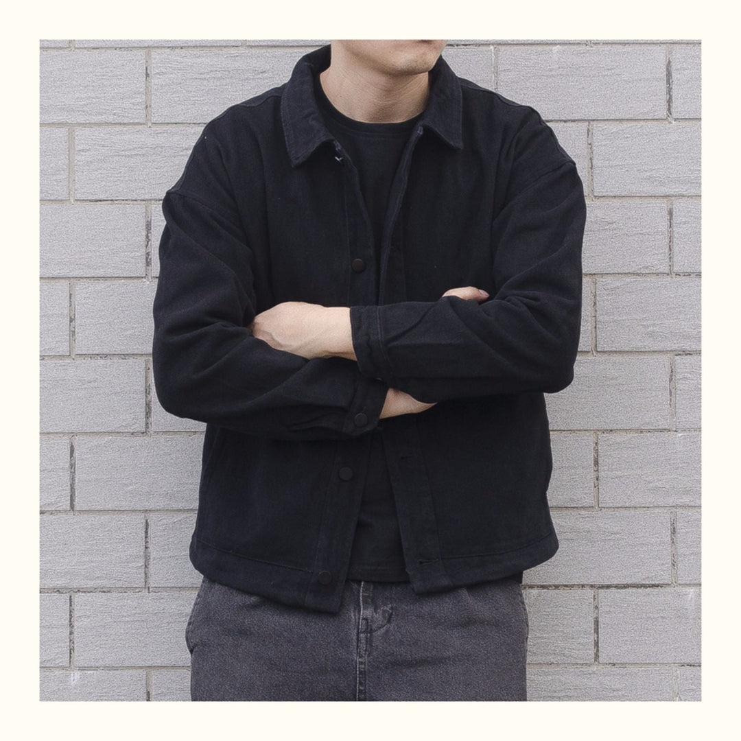 Close-up of men's collared button-down jacket, highlighting the casual style & durable outerwear.