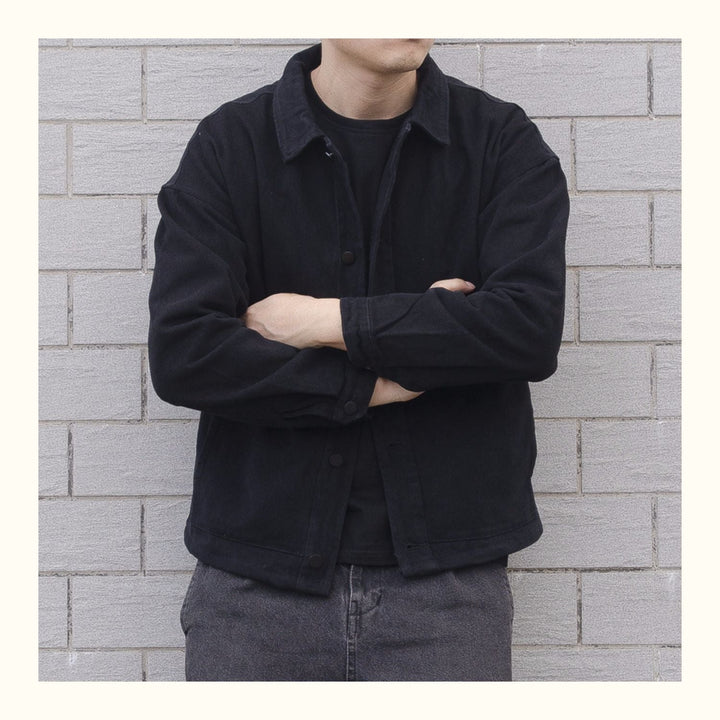 Close-up of men's collared button-down jacket, highlighting the casual style & durable outerwear.