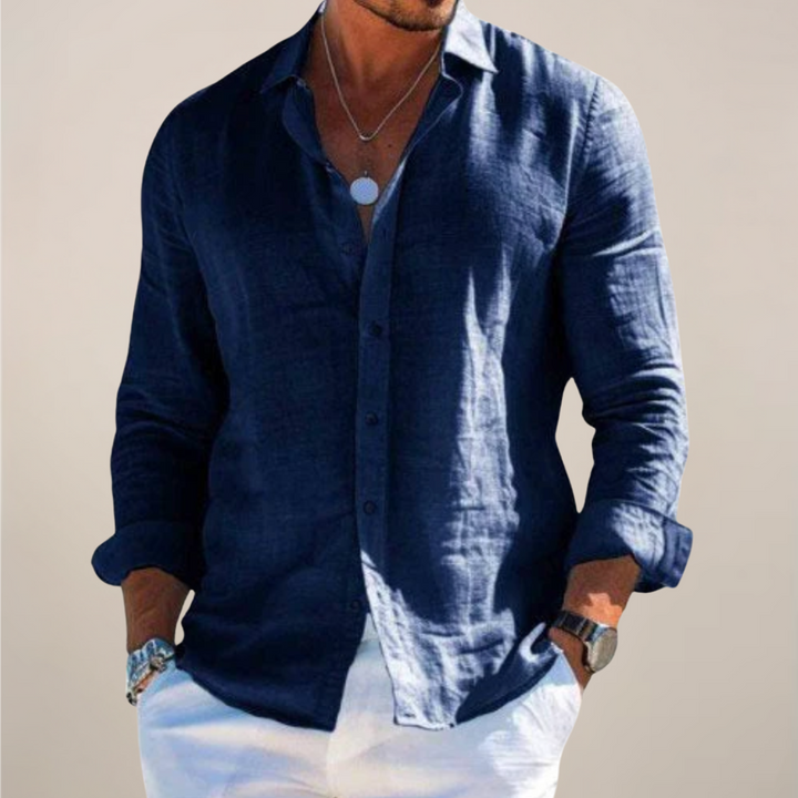 Blue men's casual button-down shirt, lightweight for summer elegance. Perfect warm weather holiday menswear.