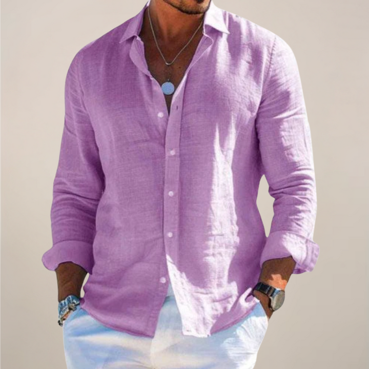 Man wearing a relaxed fit casual button-down shirt, enjoying a stylish summer day. Ideal holiday topwear.