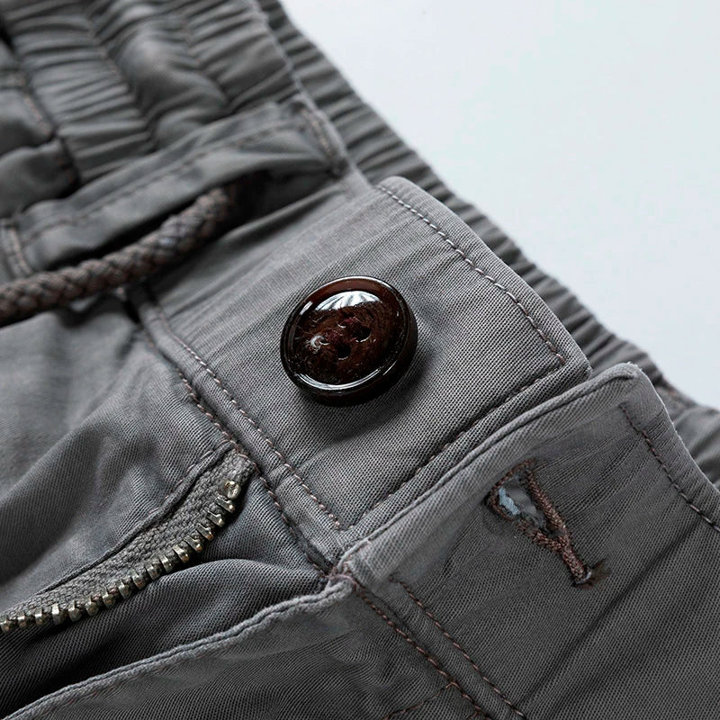 Lightweight men's cargo shorts with elastic drawstring waist, essential for summer adventures & casual style.