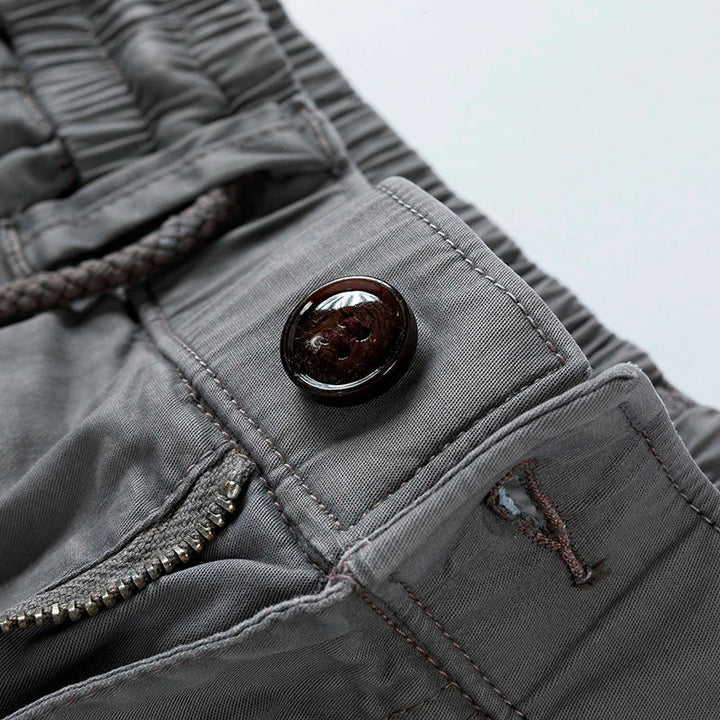 Lightweight men's cargo shorts with elastic drawstring waist, essential for summer adventures & casual style.