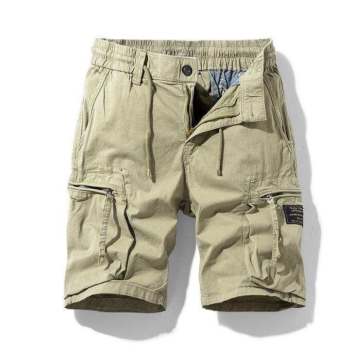 Relaxed fit men's cargo shorts with drawstring waist, essential for summer fashion & outdoor comfort.