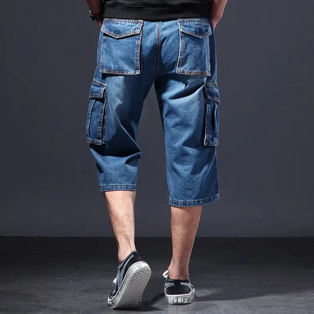Stylish men's denim cargo shorts featuring practical side pockets, perfect for casual utility and summer fashion.