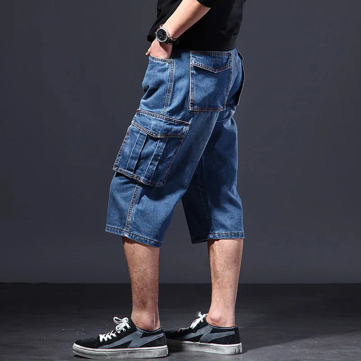 Relaxed fit men's denim cargo shorts for casual wear, durable material with functional pockets for summer.