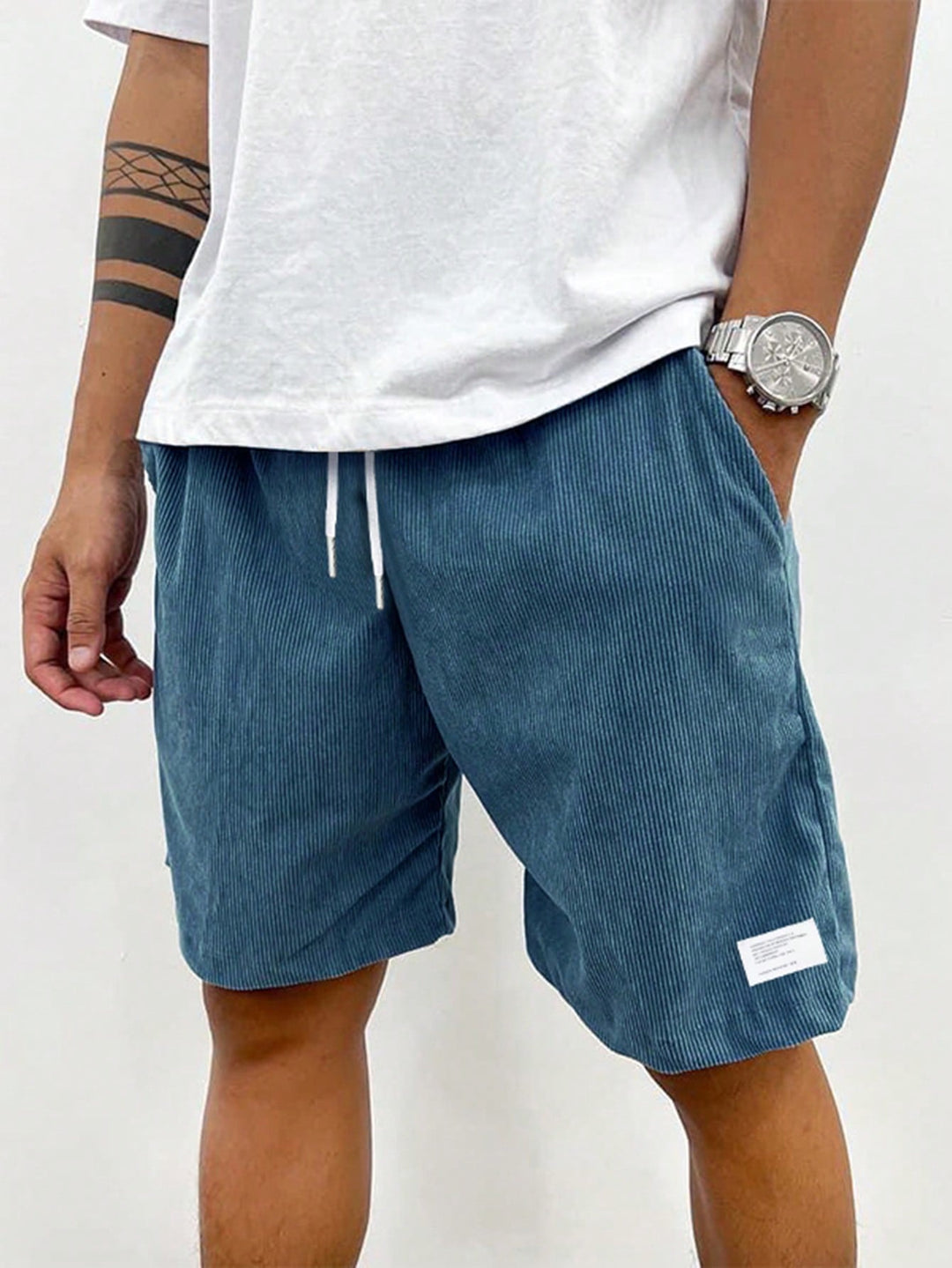 Black men's ribbed casual shorts. Drawstring waist for comfort & style. Versatile for everyday summer wear.