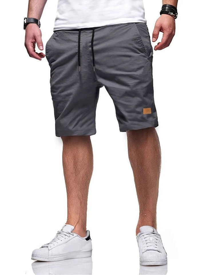 Athletic-inspired men's casual drawstring shorts, offering comfort for active or relaxed days.
