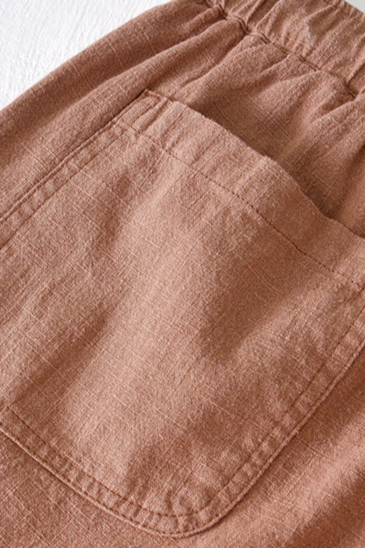 Khaki men's elasticated waist shorts with drawstring and practical side pockets