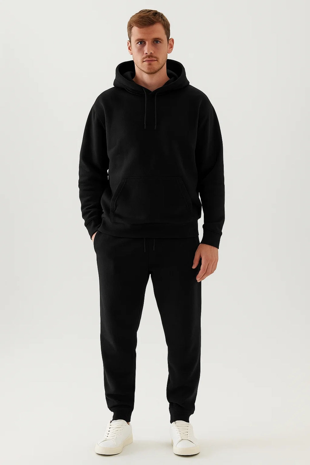 Full view of a men's casual tracksuit set with a hooded sweatshirt and matching comfortable joggers.