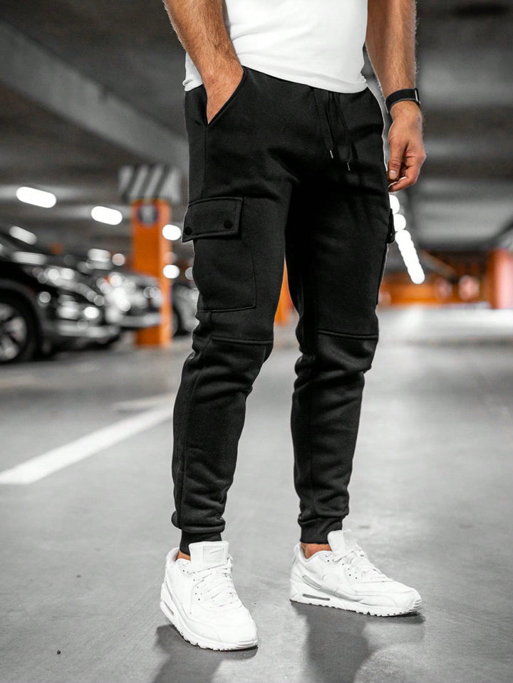 Front view of men's army green jogger cargo pants with tapered leg