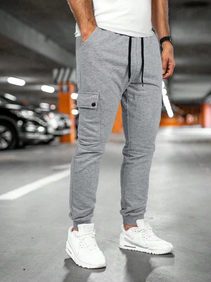 Close-up of drawstring waist on men's casual cargo trousers