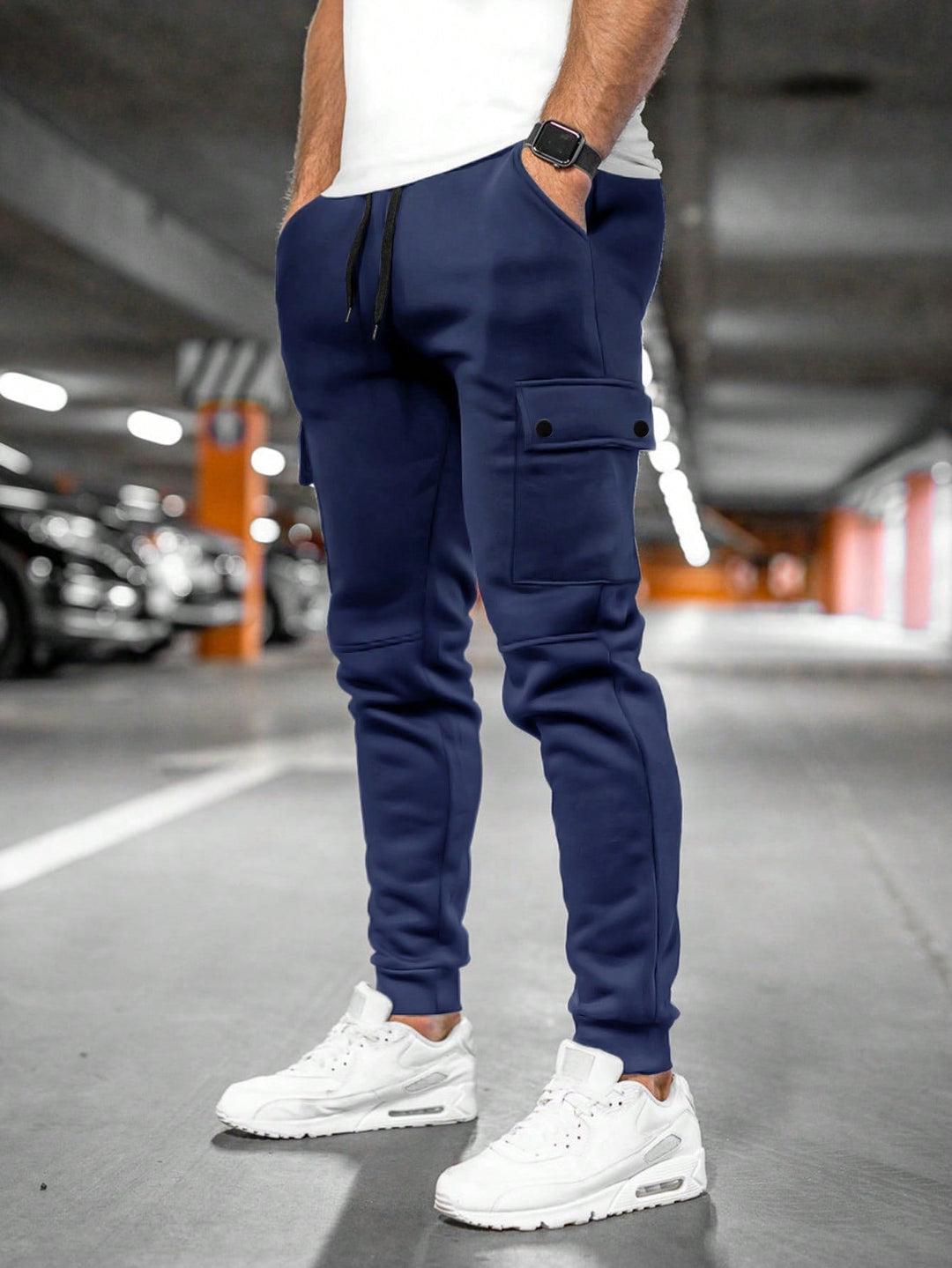 Side view of men's stretch fabric jogger cargo pants, utility style