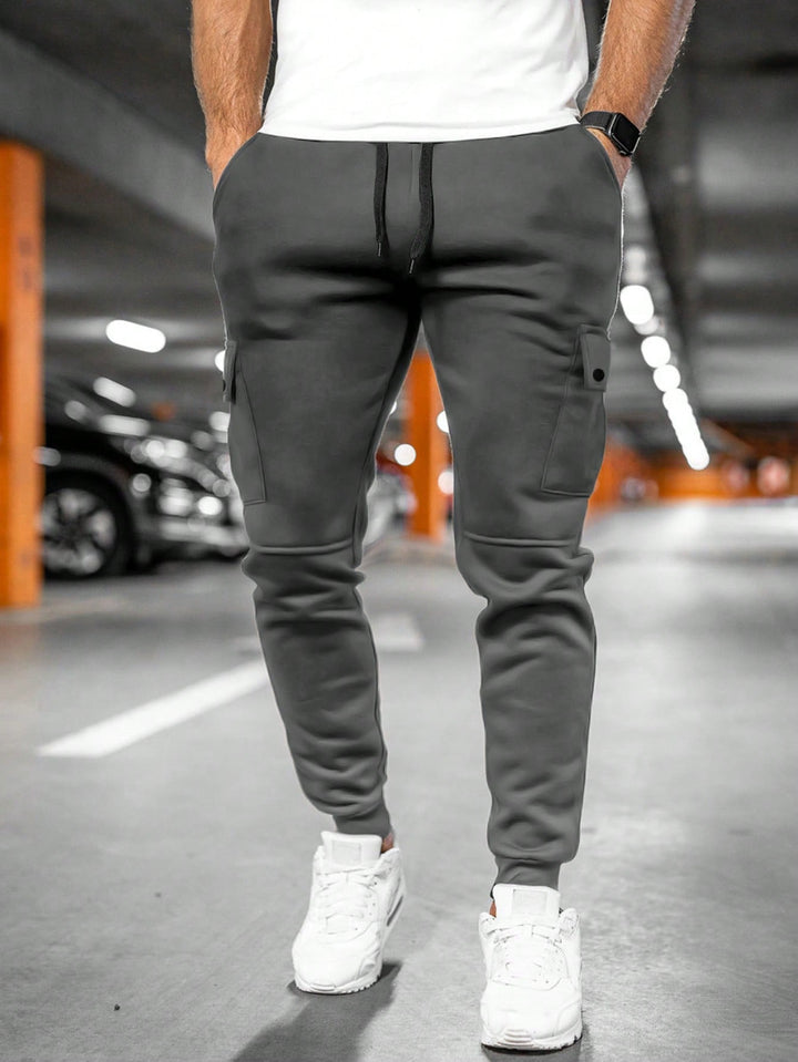 Pair of men's stretch fabric jogger cargo trousers, versatile style