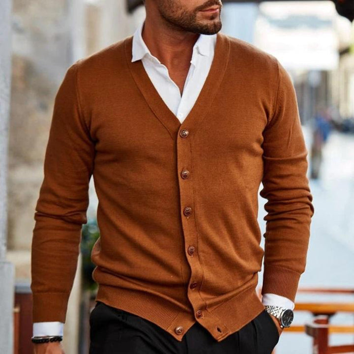 Comfortable men's casual knit cardigan, ideal for layered looks. Button-up v-neck for stylish fall & winter wear.