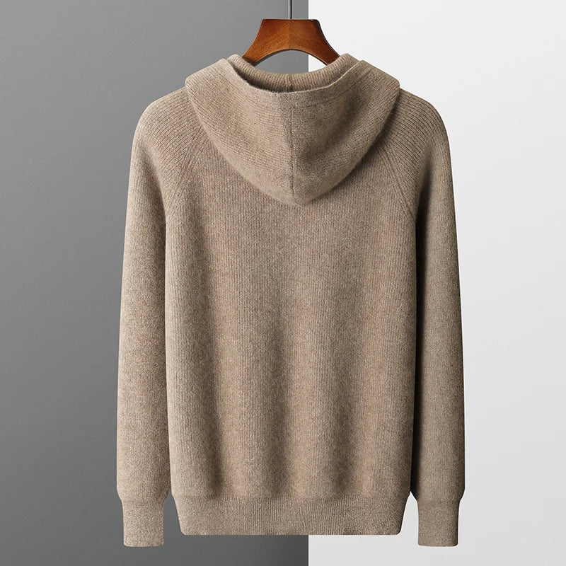 Detail of the ribbed cuffs and hem on a blue men's casual knit hoodie.