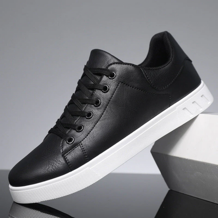 Stylish men's fashion sneakers featuring a rounded toe and secure lace-up closure.