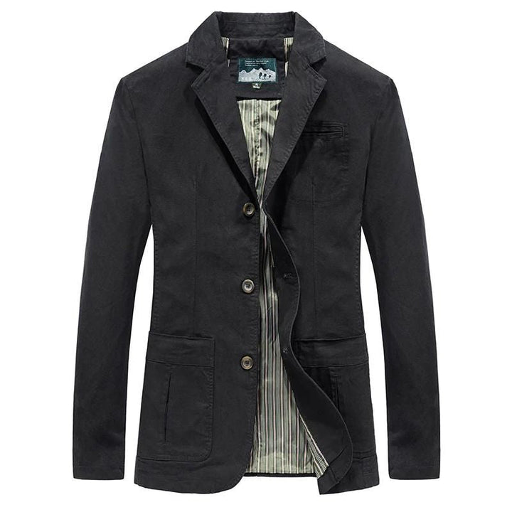A man showcasing the sharp silhouette of a tailored casual blazer.