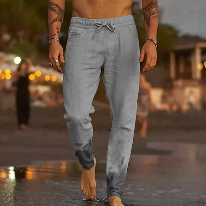 Close-up of breathable men's linen trousers showing textured fabric.