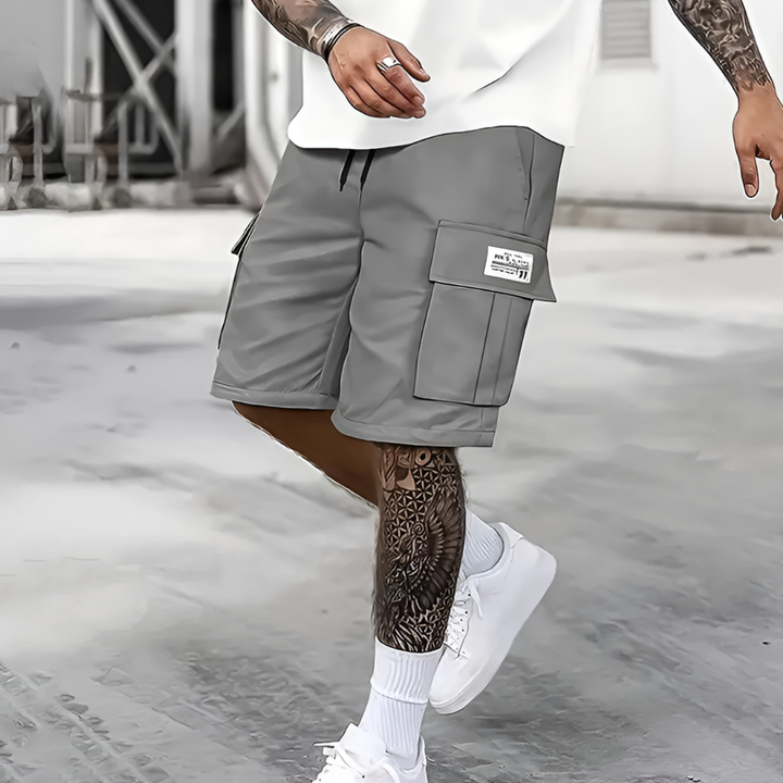 Men's casual loose fit cargo shorts with elastic waist for summer fashion & streetwear comfort. Knee-length relaxed fit.