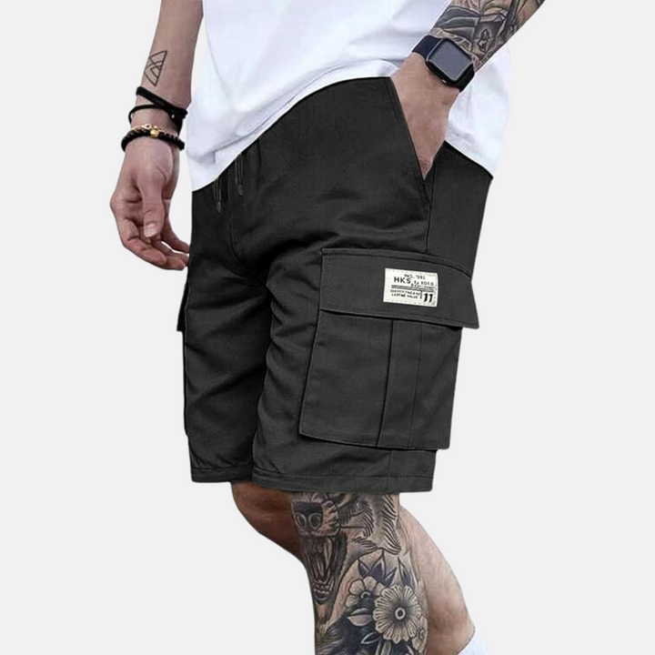 Relaxed fit men's cargo shorts, perfect for vacation wear & casual summer outings. Features a comfortable elastic waist.