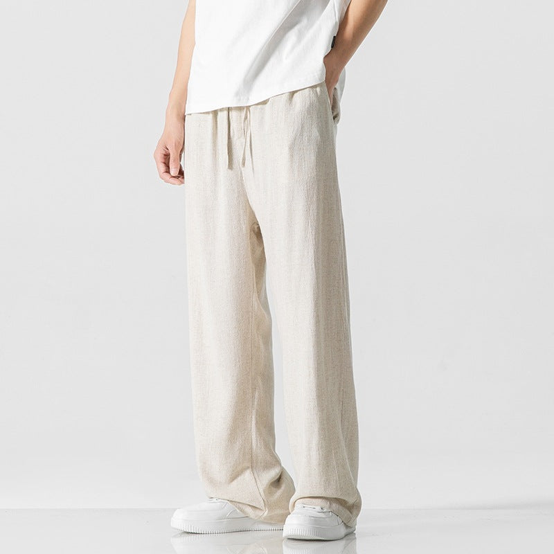 Stylish men's loose-fit casual pants with an elastic drawstring waist, full length for comfort.