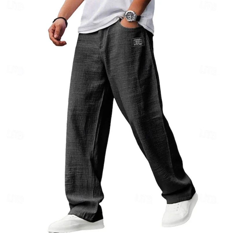 Man walking comfortably in men's casual loose everyday pants, perfect for versatile daily activities & lounge.