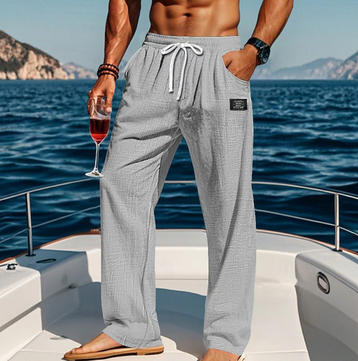 Stylish men's casual loose pants with lace detailing, perfect for summer relaxation and comfort.