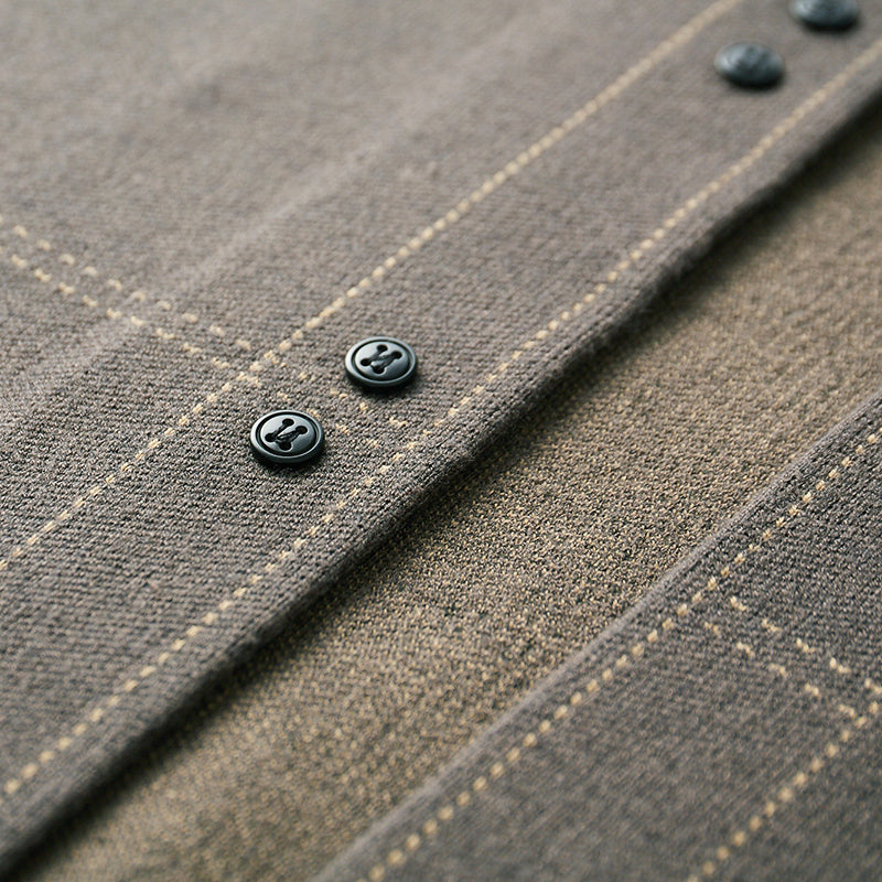 Classic plaid pattern on a men's button-front cardigan sweater, adding style to any outfit.