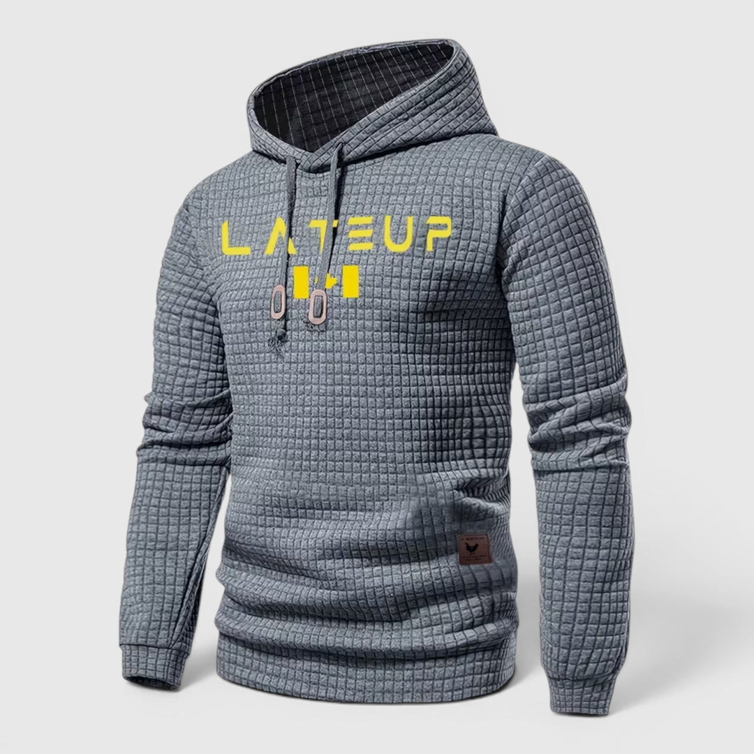 Black men's modern pullover hoodie, casual loungewear for chilly fall days.