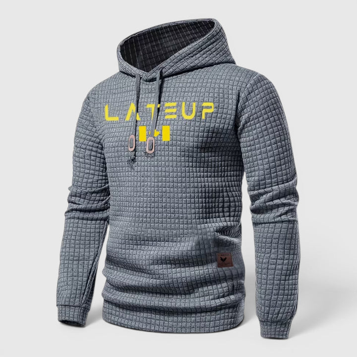 Black men's modern pullover hoodie, casual loungewear for chilly fall days.