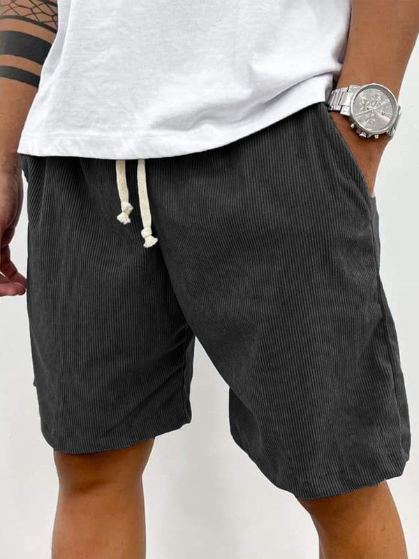 Relaxed fit men's casual stretch shorts with ribbed texture and drawstring, perfect for summer comfort.
