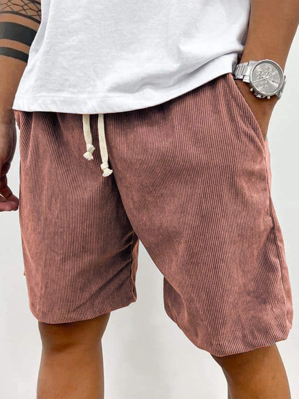 Man enjoying summer in comfortable, relaxed fit men's casual ribbed stretch shorts with drawstring.